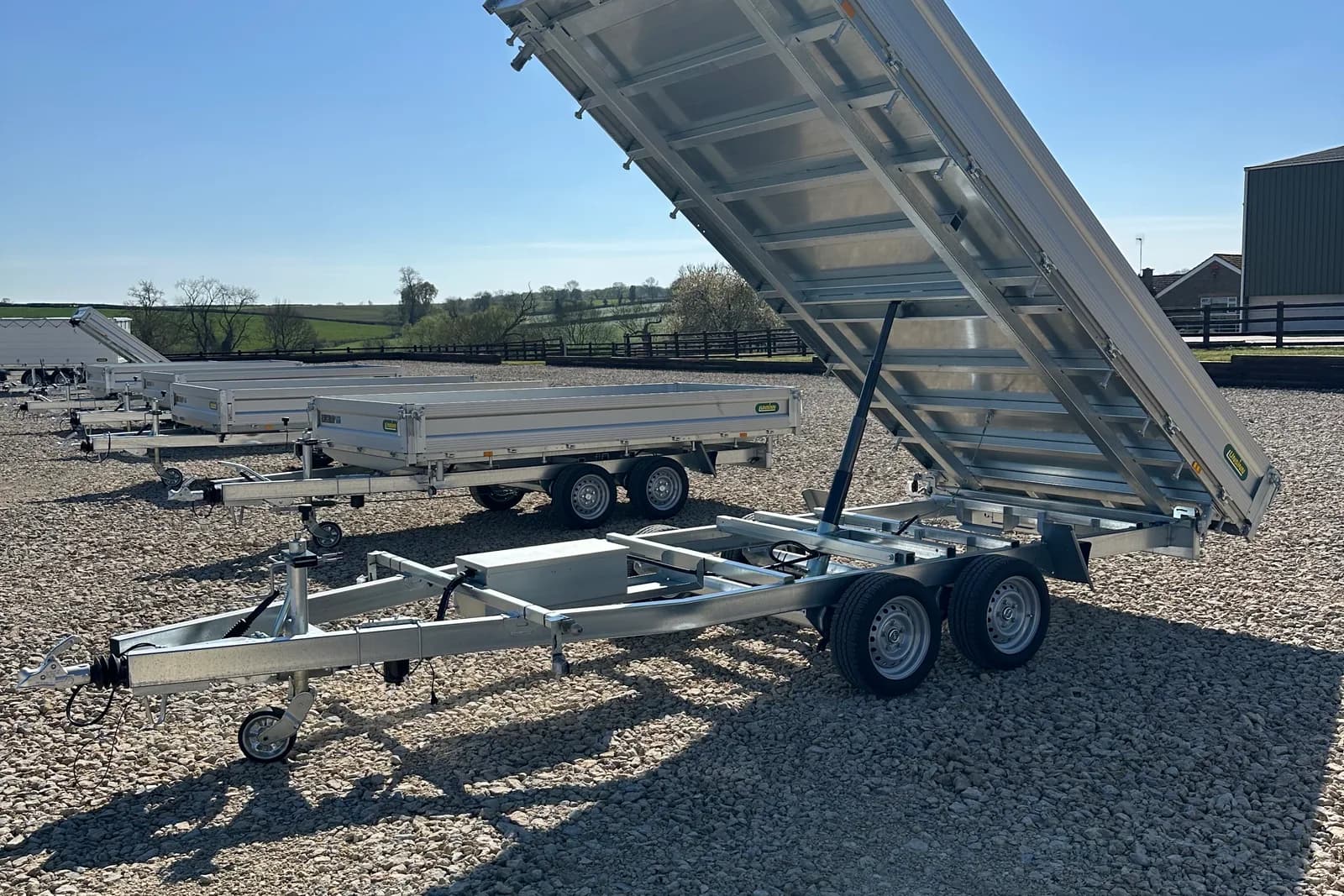 Simply Trailers yard with tipper and flatbed stock on display